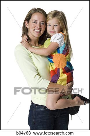 Woman holding girl View Large Photo Image Stock Image - Woman holding girl. Fotosearch