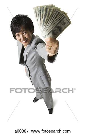 Woman holding money View Large Photo Image Stock Photo - Woman holding money. Fotosearch