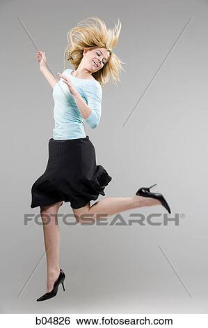 Woman in black dancing View Large Photo Image Stock Photograph - Woman in black dancing. Fotosearch