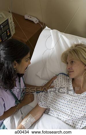 Woman in hospital bed View Large Photo Image Picture - Woman in hospital bed. Fotosearch