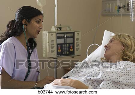 Woman in hospital bed View Large Photo Image Picture - Woman in hospital bed. Fotosearch