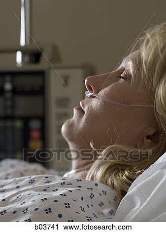 Woman in hospital bed View Large Photo Image Stock Image - Woman in hospital bed. Fotosearch