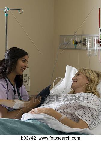 Woman in hospital bed View Large Photo Image Stock Image - Woman in hospital bed. Fotosearch