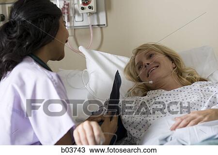 Woman in hospital bed View Large Photo Image Stock Image - Woman in hospital bed. Fotosearch