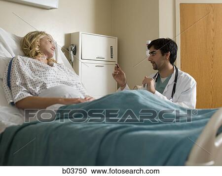 Woman in hospital bed View Large Photo Image Stock Image - Woman in hospital bed. Fotosearch