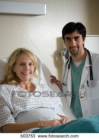 Stock Image - Woman in hospital bed. Fotosearch