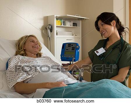 Woman in hospital bed View Large Photo Image Stock Image - Woman in hospital bed. Fotosearch