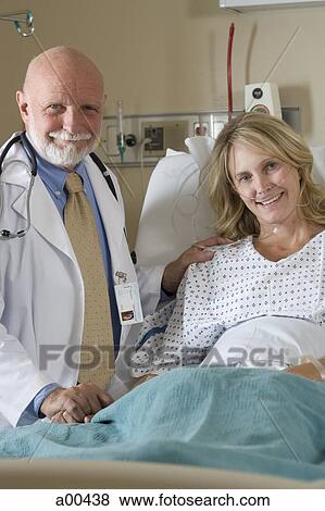 Stock Photo - Woman in hospital bed. Fotosearch