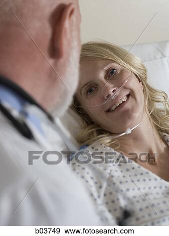 Woman in hospital bed View Large Photo Image Stock Photo - Woman in hospital bed. Fotosearch