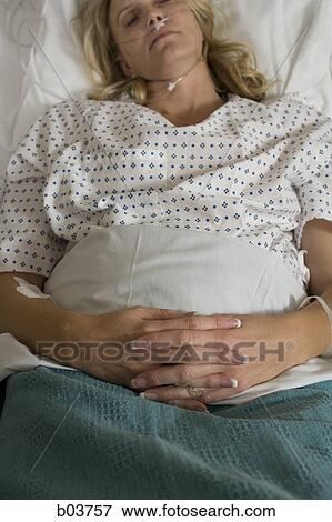Woman in hospital bed View Large Photo Image Stock Photo - Woman in hospital bed. Fotosearch