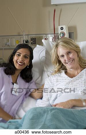 Stock Photograph - Woman in hospital bed. Fotosearch