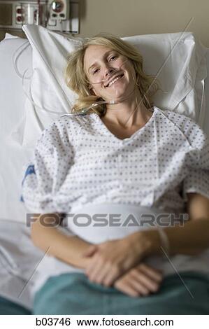 Woman in hospital bed View Large Photo Image Stock Photograph - Woman in hospital bed. Fotosearch
