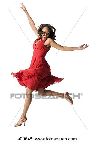 Woman in red dress dancing View Large Photo Image Stock Photography - Woman in red dress dancing. Fotosearch