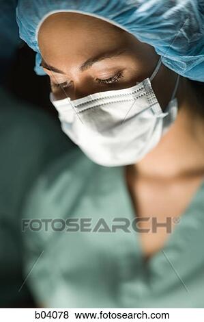 Stock Photo - Woman in surgical scrubs. Fotosearch
