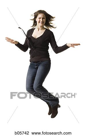 Stock Image - Woman jumping. Fotosearch