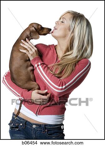 Woman kissing a Daschund View Large Photo Image Picture - Woman kissing a Daschund. Fotosearch