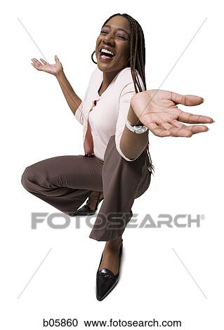 Woman kneeling and shrugging View Large Photo Image Stock Image - Woman kneeling and shrugging. Fotosearch