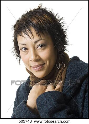 Stock Image - Woman looking at the camera. Fotosearch
