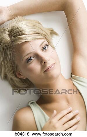 Stock Photo - Woman lying down. Fotosearch