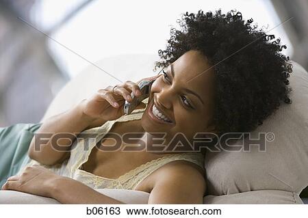 Stock Image - Woman on a cell phone. Fotosearch