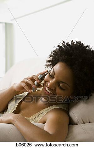 Woman on a cell phone View Large Photo Image Stock Photograph - Woman on a cell phone. Fotosearch