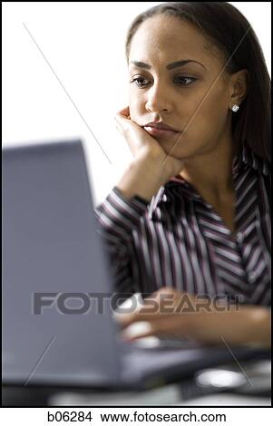 Picture - Woman on a laptop. Fotosearch