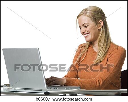 Stock Photo - Woman on a laptop. Fotosearch