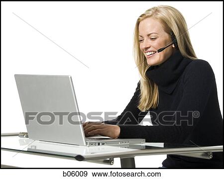 Woman on a laptop View Large Photo Image Stock Photo - Woman on a laptop. Fotosearch