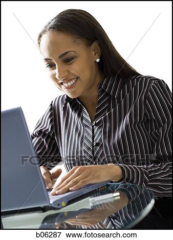 Stock Photo - Woman on a laptop. Fotosearch