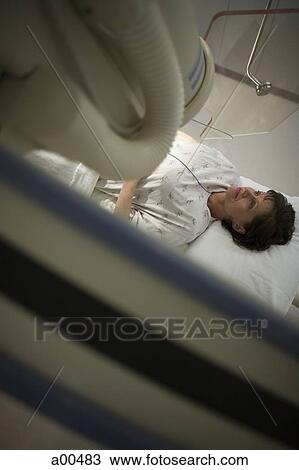 Woman on hospital bed from above View Large Photo Image Stock Image - Woman on hospital bed from above. Fotosearch