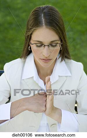 Woman outside making a fist View Large Photo Image Stock Photograph - Woman outside making a fist. Fotosearch