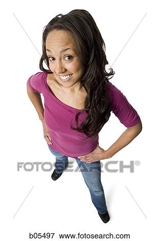 Woman posing with hands on hips looking up View Large Photo Image Stock Photo - Woman posing with hands on hips looking up. Fotosearch
