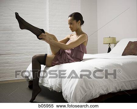 Woman putting on pantyhose View Large Photo Image Stock Photography - Woman putting on pantyhose. Fotosearch