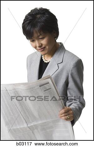 Stock Photo - Woman reading newspaper. Fotosearch