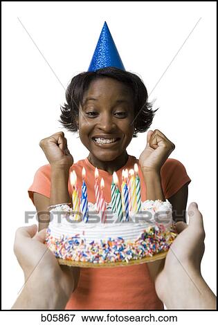 Woman receiving a birthday cake View Large Photo Image Stock Photo - Woman receiving a birthday cake. Fotosearch