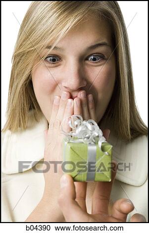 Woman receiving gift box View Large Photo Image Stock Image - Woman receiving gift box. Fotosearch