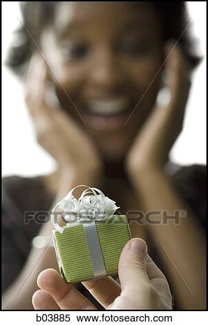 Woman receiving gift box View Large Photo Image Stock Photography - Woman receiving gift box. Fotosearch