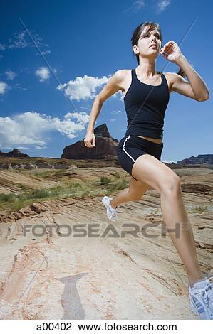 Woman running in desert View Large Photo Image Stock Image - Woman running in desert. Fotosearch