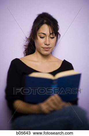 Woman sitting and reading book View Large Photo Image Stock Image - Woman sitting and reading book. Fotosearch