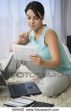 Woman sitting cross legged with laptop View Large Photo Image Stock Image - Woman sitting cross legged with laptop. Fotosearch