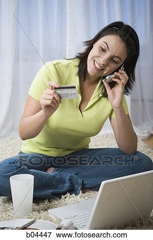 Woman sitting cross legged with laptop View Large Photo Image Stock Photo - Woman sitting cross legged with laptop. Fotosearch