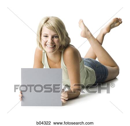 Stock Image - Woman sitting with blank sign. Fotosearch