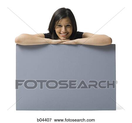 Woman sitting with blank sign View Large Photo Image Stock Photo - Woman sitting with blank sign. Fotosearch