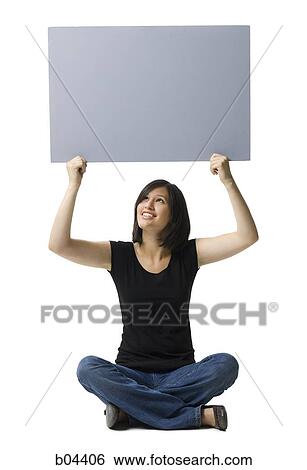 Woman sitting with blank sign View Large Photo Image Stock Photograph - Woman sitting with blank sign. Fotosearch