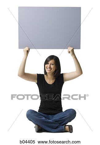 Woman sitting with blank sign View Large Photo Image Stock Photography - Woman sitting with blank sign. Fotosearch