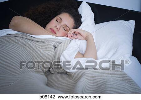 Woman sleeping in bed View Large Photo Image Stock Image - Woman sleeping in bed. Fotosearch