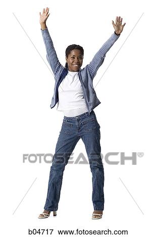 Woman standing with arms up View Large Photo Image Stock Photo - Woman standing with arms up. Fotosearch