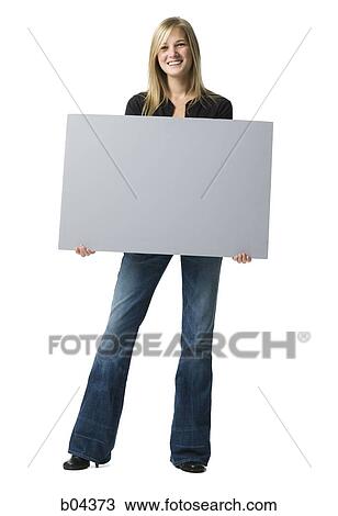 Woman standing with blank sign View Large Photo Image Stock Image - Woman standing with blank sign. Fotosearch