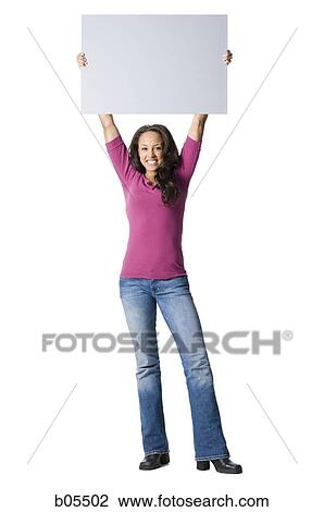 Woman standing with blank sign View Large Photo Image Stock Image - Woman standing with blank sign. Fotosearch