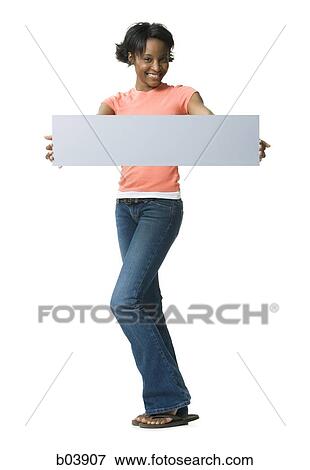 Woman standing with blank sign View Large Photo Image Stock Photo - Woman standing with blank sign. Fotosearch